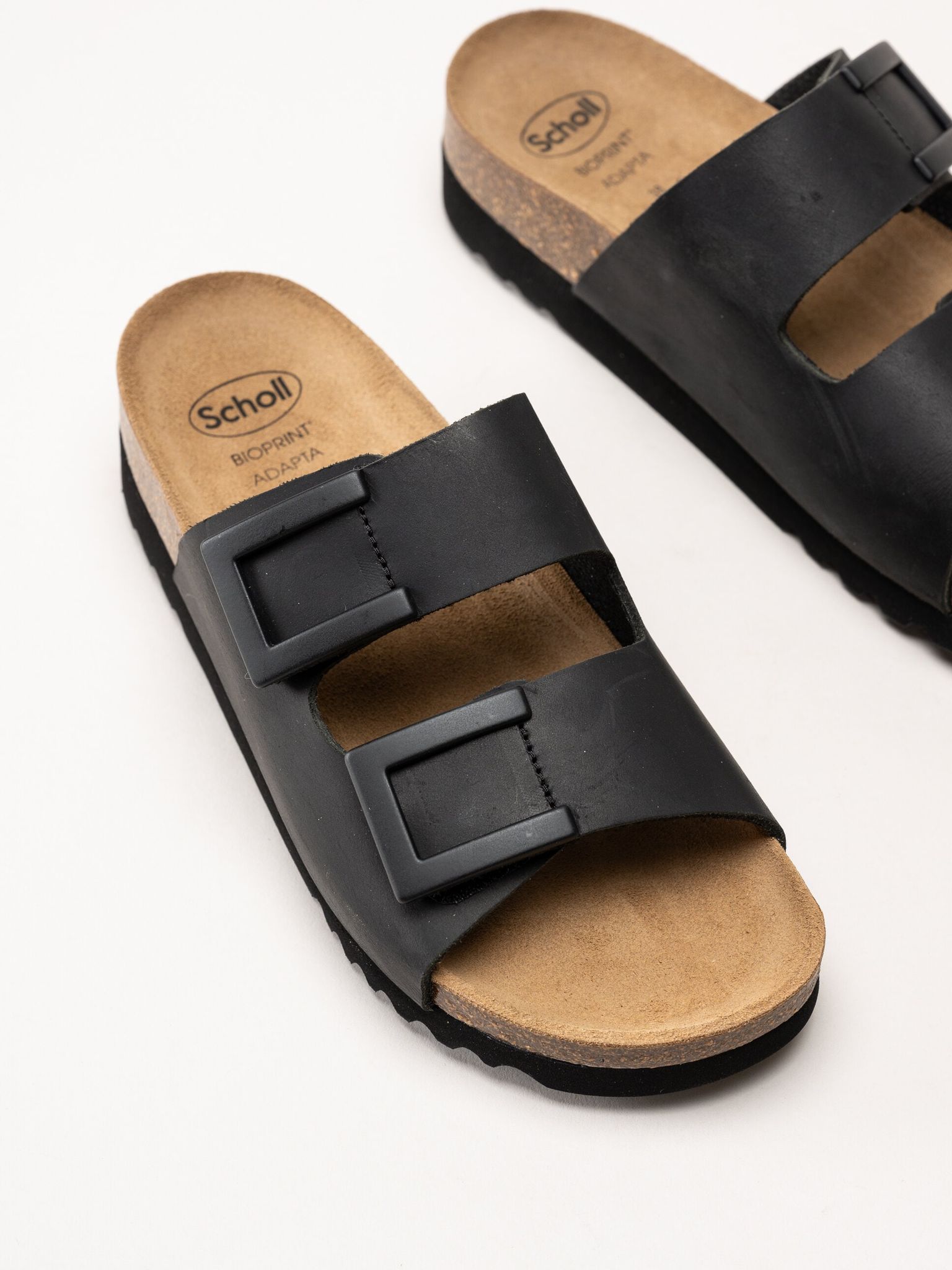 Scholl - Monterey 2 Straps - Svarta slip in sandaler i oljat skinn